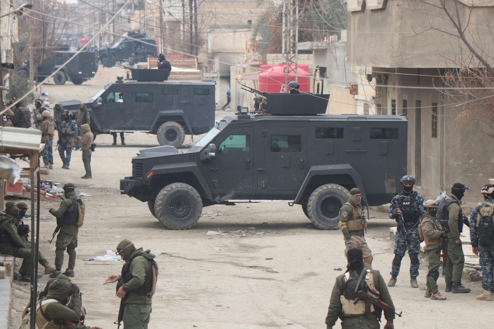 Soldiers and Military Vehicles on a Street. Al Hasakah, Al-Hasakah Governorate, Syria