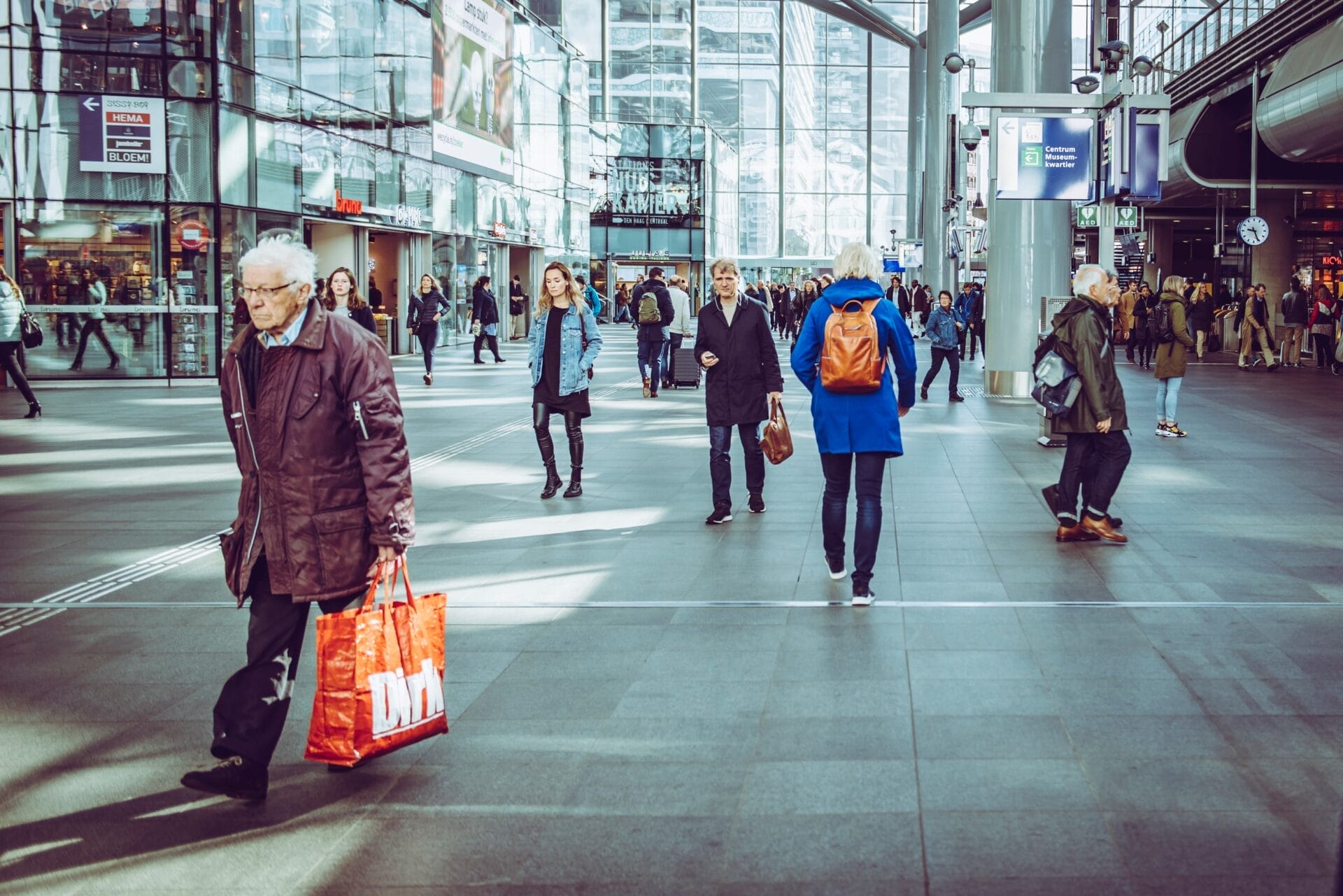 Crowd of people walking inside a building. The Hague, Netherlands