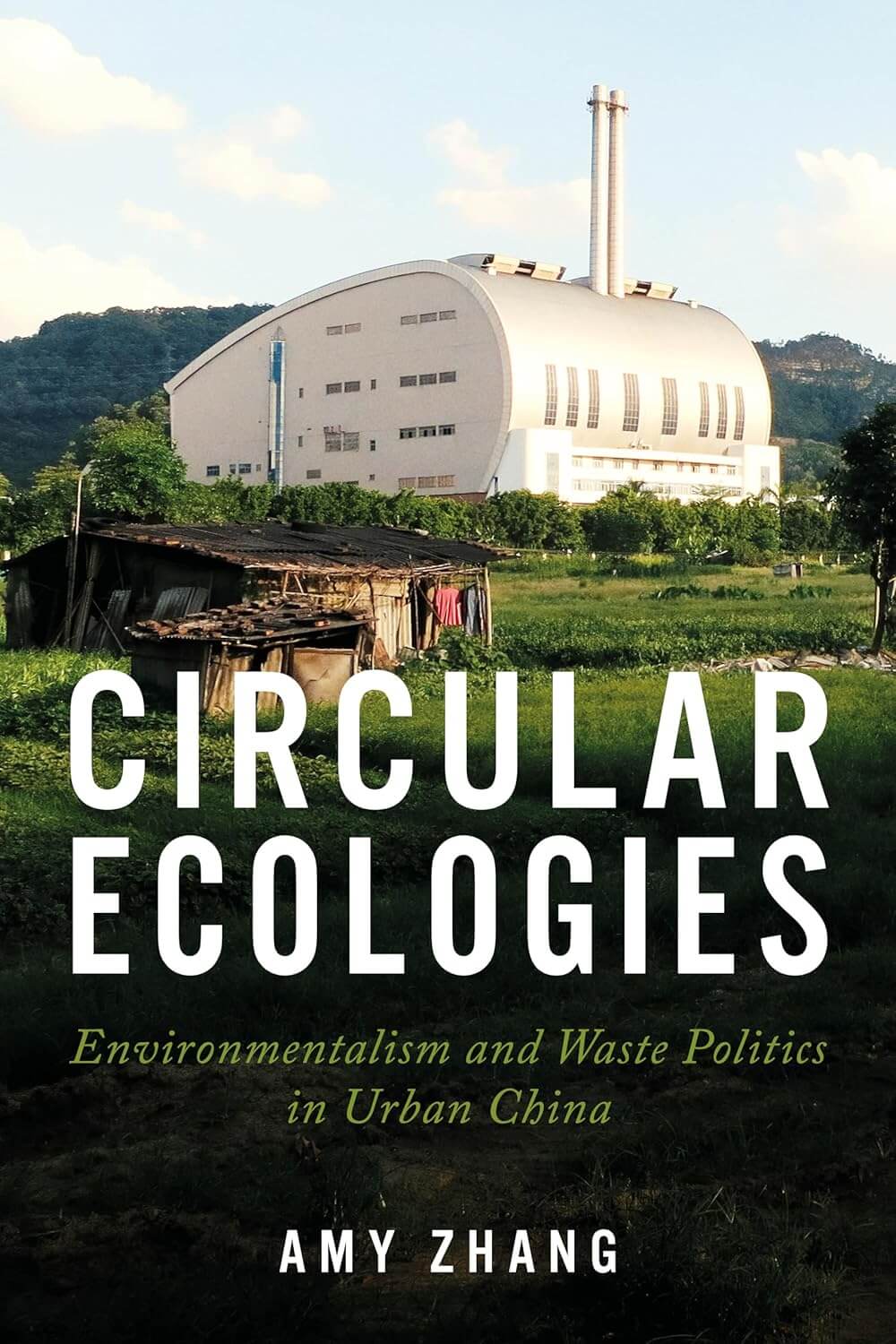 Circular Ecologies book cover. Modern factory building next to dilapidated shack in field.