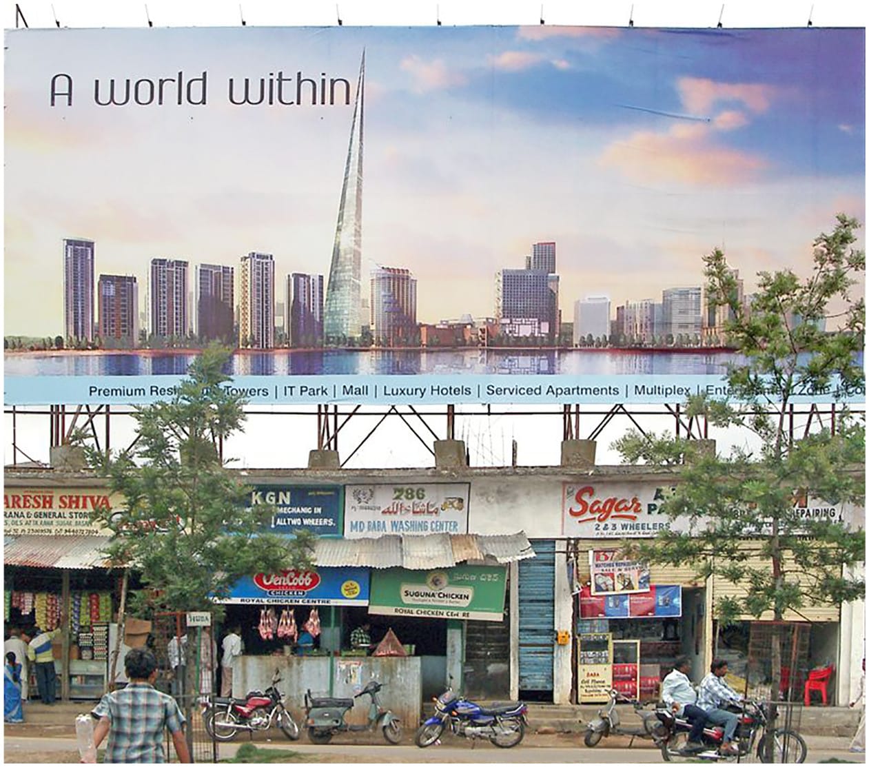 Billboard showing luxury development buildings above underdeveloped retail buildings on the street